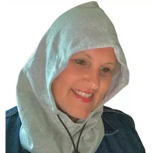 Woman wearing soft silver cotton EMF shielding hood for EMF protection by Redemption Shield